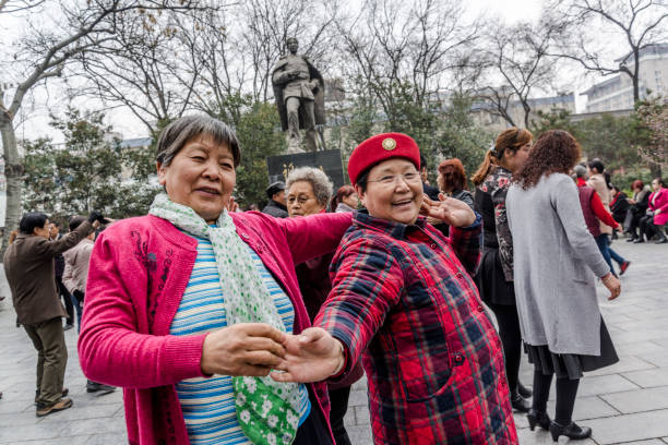 Elderly people dancing in a public park, Xi'an, Shaanxi province, China