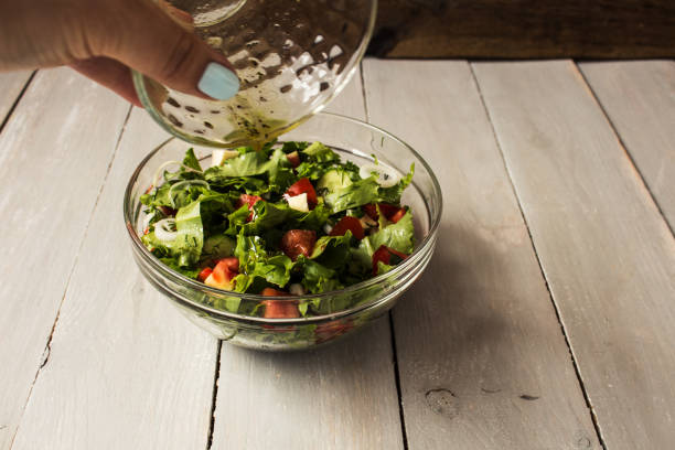 istock bowl of fresh salad with salad dressing 802443666