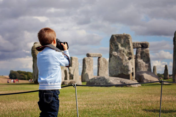 istock Young child, boy, taking pic with digital camera at Stonehenge 802444340