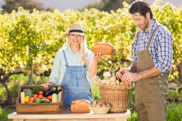 istock Happy farmer woman holding a bread 802448850