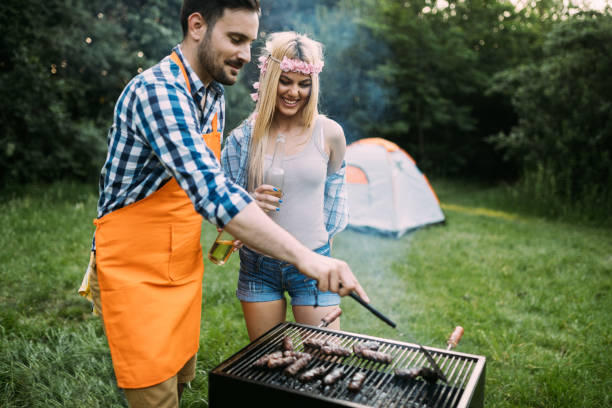 istock Beautiful woman and handsome man having barbecue 802449166