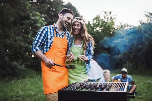 istock Beautiful woman and handsome man having barbecue 802449220