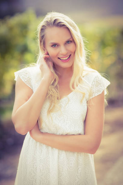 istock Pretty blonde woman looking at the camera 802449260