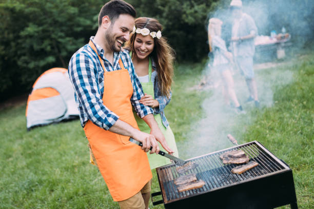 istock Friends spending time in nature and having barbecue 802449456