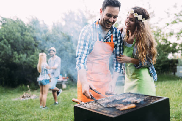 istock Friends spending time in nature and having barbecue 802449508
