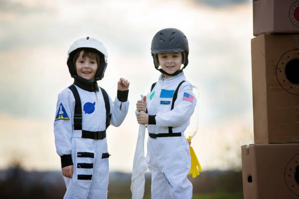 istock Two adorable children, playing in park on sunset 802452238
