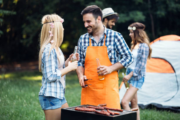 istock Friends spending time in nature and having barbecue 802452434
