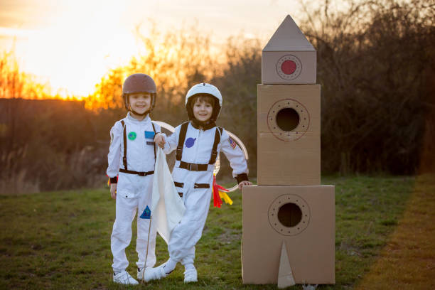 istock Two adorable children, playing in park on sunset 802452486