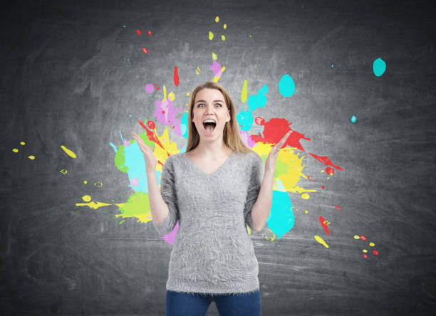 istock Happy woman and color splashes 802455964