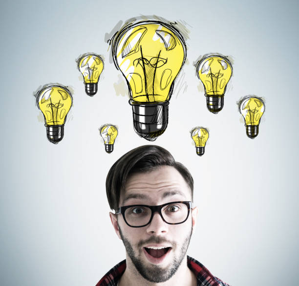 istock Surprised man in glasses head and his ideas 802458902
