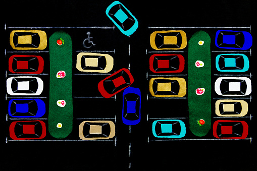 Fabric parking lot. Cars and lawn with flowers made of colorful pieces of fabric isolated on black background