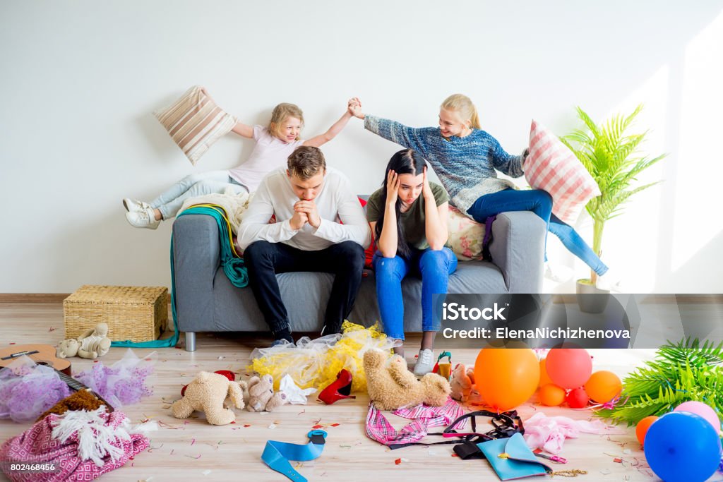 Kids romping at home Kids romping at home creating a mess parents are stressed Messy Stock Photo