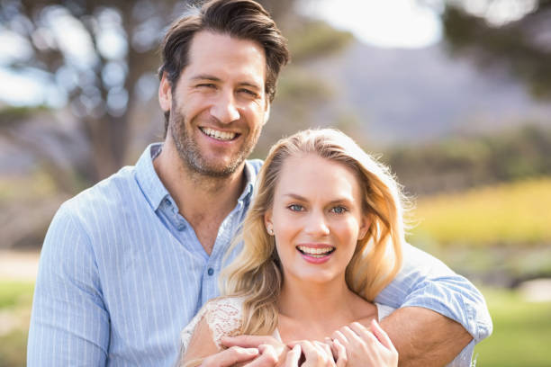 istock Cute couple on date looking at the camera 802472018