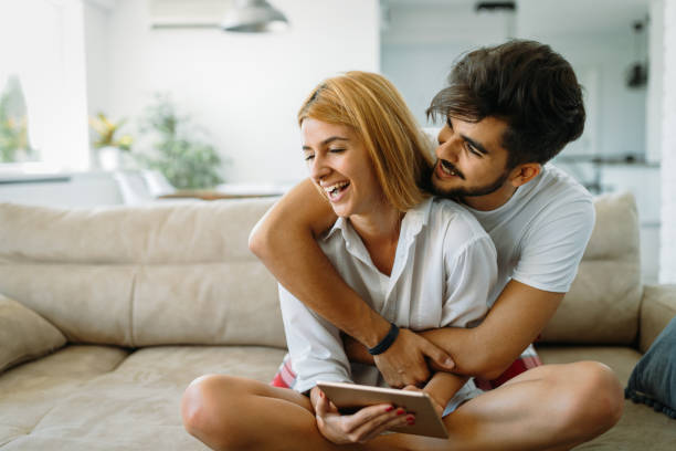 istock Young attractive couple spending time together at home 802472604