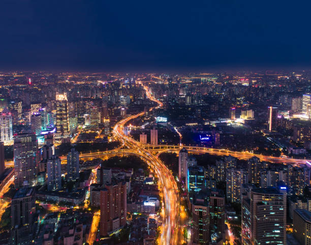 istock Aerial view of  elevated highway and overpass in modern city at night 802477882
