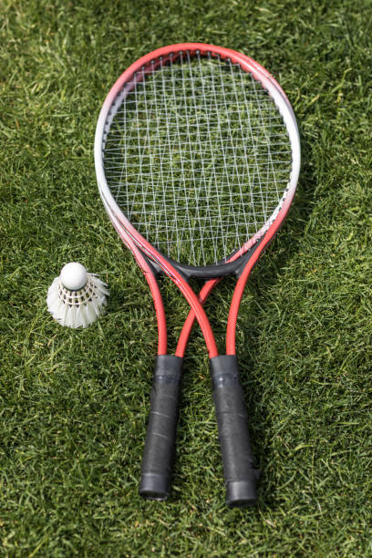 istock top view of badminton rackets with shuttlecock on grass field 802480596
