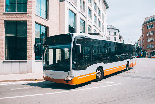A modern bus in a urban environment
