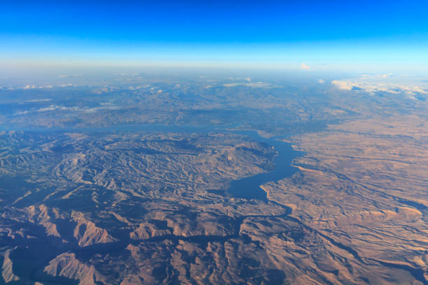 istock Wing of an airplane flying above the clouds 802481352