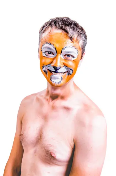 Close-up portrait of smiling and fooling around animator in lion theater role. No suit, topless. Emotional and colorful portrait. Isolated background