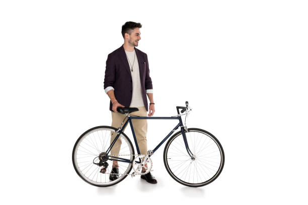 istock Full length view of handsome stylish young man standing with bicycle isolated on white 802493192