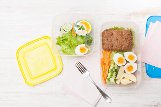 istock Cut vegetables, sandwich in an open food container 802496714