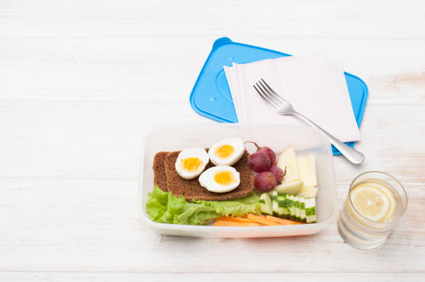istock Cut vegetables, sandwich in an open food container 802496942