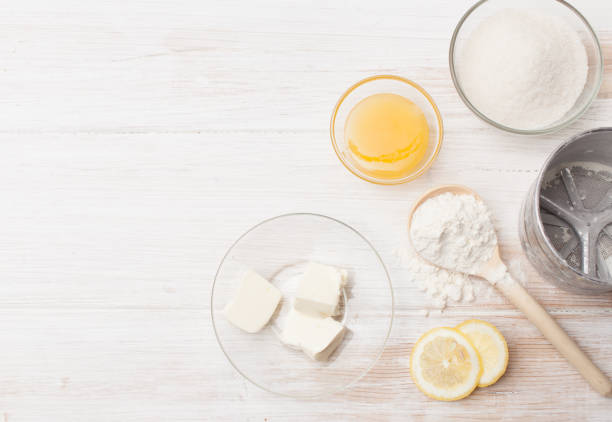 istock Pieces of butter, lemon, honey, flour and sugar on the table 802497222