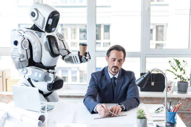 istock Courteous android is giving espresso for businessman 802508118