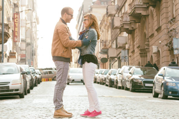 Young urban couple posing on the street.