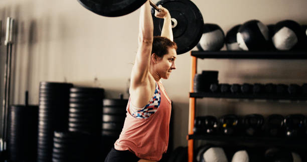 istock Young Woman in Gym 802539390