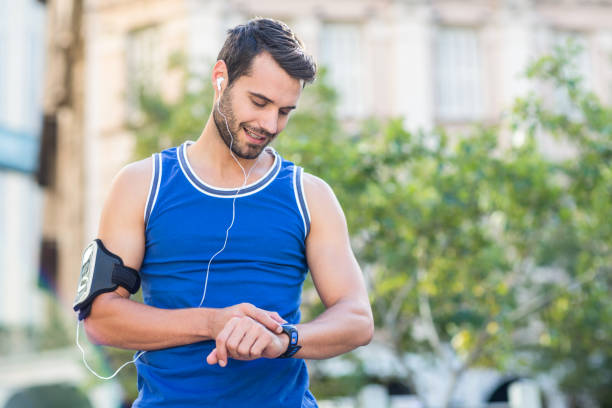 istock An handsome athlete looking at the time 802544146