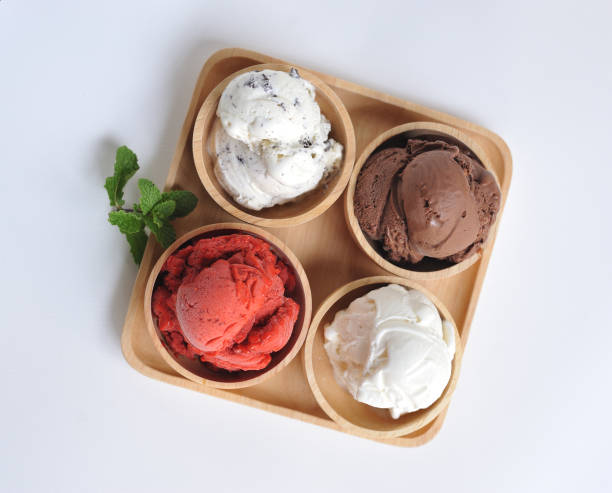 istock Homemade mixed  Ice cream scoops on wooden bowl 802545920