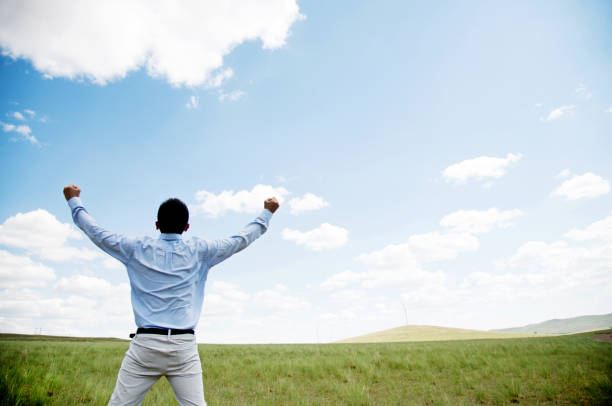 istock The man standing on the grassland 802550898