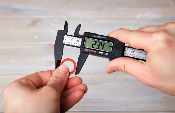 Measurement with digital caliper Measurement of the diameter of the gasket using a digital caliper caliper stock pictures, royalty-free photos & images