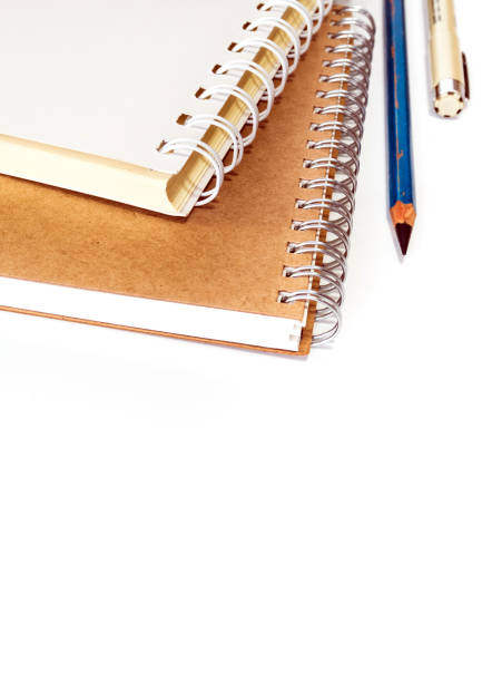 istock The spiral notebook with pencil and pen 802558266