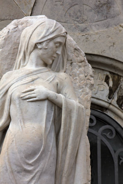 istock Statue of a classical female in cemetery 802563204