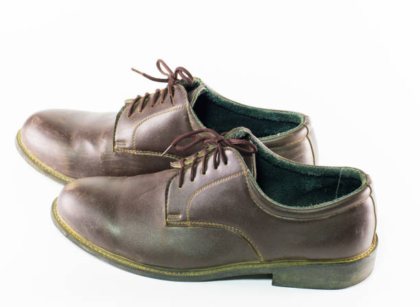 istock pair  brown leather shoes isolated on white background , classic male shoe on white background ,close up shoes 802565430