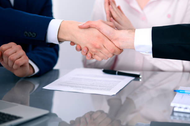 istock Business people shaking hands finishing up a meeting 802565976