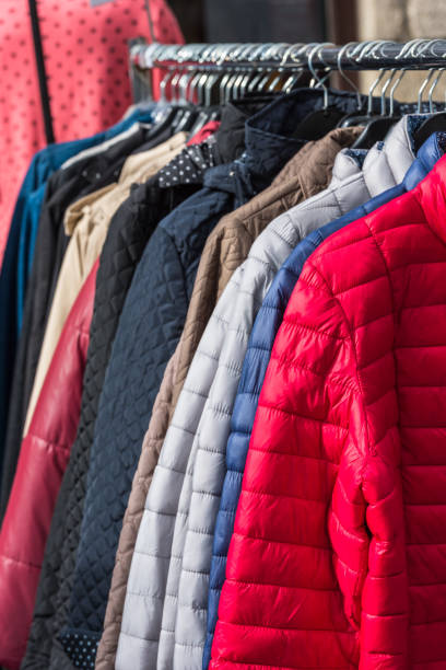istock Winter clothes hanging at a store 802566388
