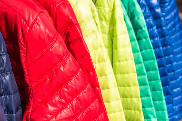 istock Winter clothes hanging at a store 802573438