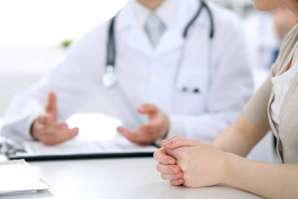 istock Doctor and patient are discussing something, just hands at the table 802573686