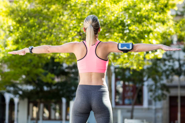 istock A beautiful athlete stretching her arms 802573944