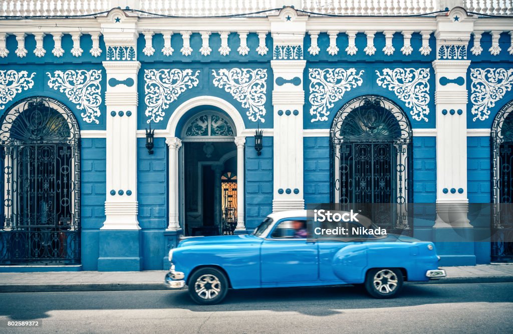Old vintage car in front of colonial style house, Cuba Old vintage car on the street, Camagüey Cuba Cuba Stock Photo