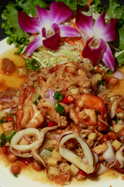 istock thailand spicy salad with herb 802589770