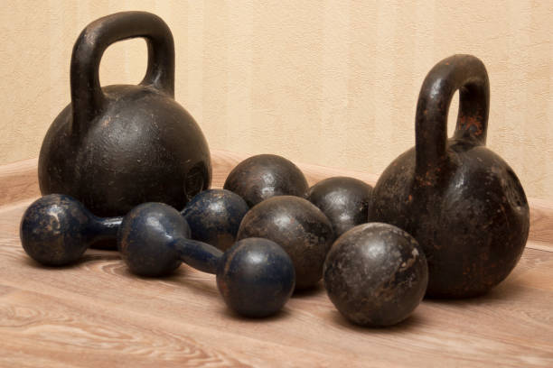 istock Dumbbells and kettlebells on the floor - 3 802596868