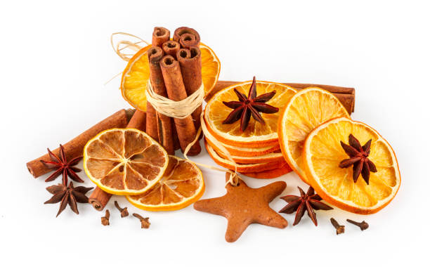 istock Dried oranges, star anise, cinnamon sticks and gingerbread, isolated on white background 802608038