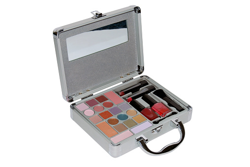 metallic makeup case with some colors, lipsticks and brushes