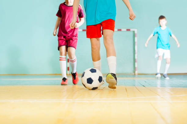 istock Football player striking ball during match 802617456