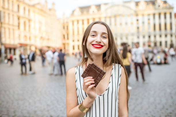 istock Woman with chocolate outdoors in Brussels 802618202