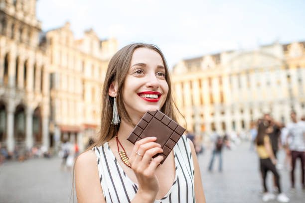 istock Woman with chocolate outdoors in Brussels 802618242